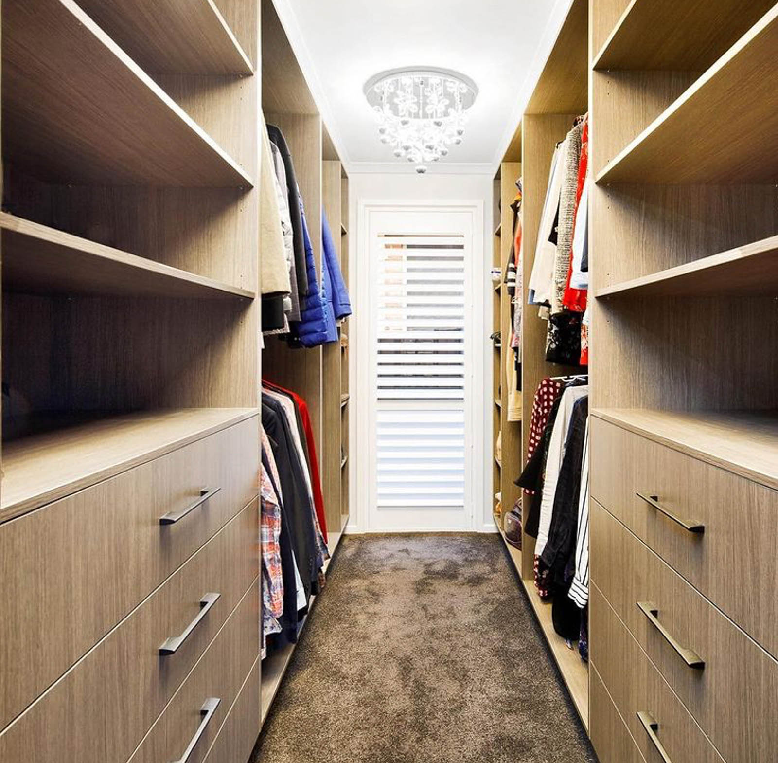 Custom walk-in wardrobe with built-in storage and shelving